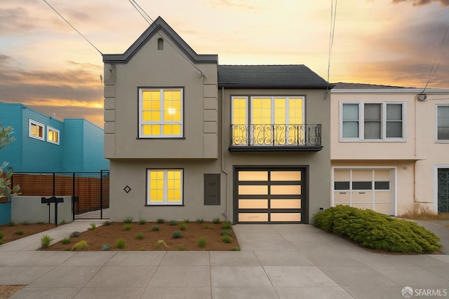 2277 33rd Ave, San Francisco, CA 94116 - view of front of home with stucco siding, an attached garage, and driveway
