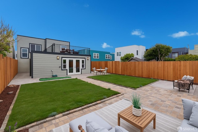 2277 33rd Ave, San Francisco, CA 94116 - back of property with french doors, a patio, a fenced backyard, and a balcony