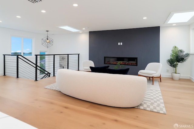 2277 33rd Ave, San Francisco, CA 94116 - living area with a skylight, light wood finished floors, and recessed lighting