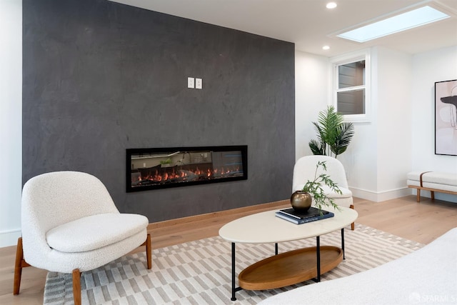 2277 33rd Ave, San Francisco, CA 94116 - sitting room featuring wood finished floors, a glass covered fireplace, and recessed lighting