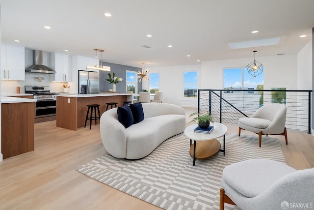 2277 33rd Ave, San Francisco, CA 94116 - living room with light wood-type flooring, recessed lighting, and a chandelier