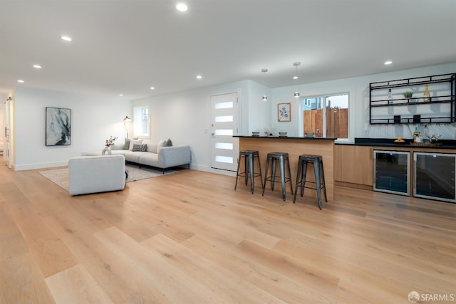 2277 33rd Ave, San Francisco, CA 94116 - living room featuring beverage cooler, wet bar, light wood-type flooring, and recessed lighting