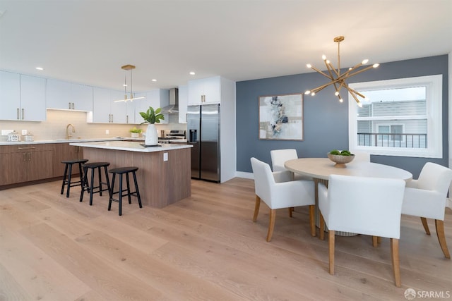 2277 33rd Ave, San Francisco, CA 94116 - dining area featuring light wood-type flooring, a chandelier, and recessed lighting