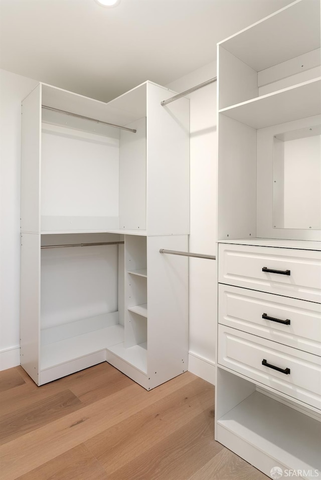 2277 33rd Ave, San Francisco, CA 94116 - walk in closet featuring light wood-style floors