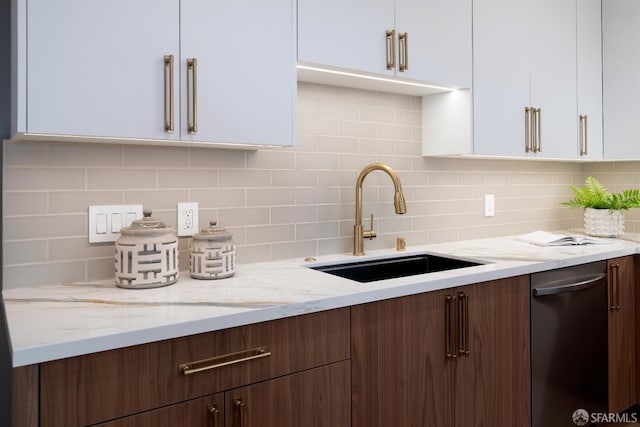 2277 33rd Ave, San Francisco, CA 94116 - kitchen with dishwasher, white cabinetry, backsplash, and light stone countertops