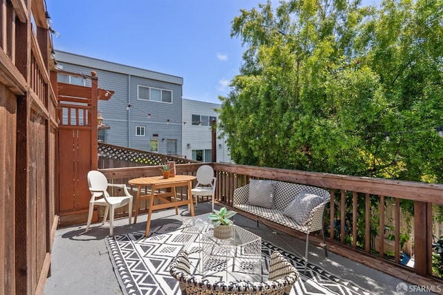 wooden deck with outdoor lounge area