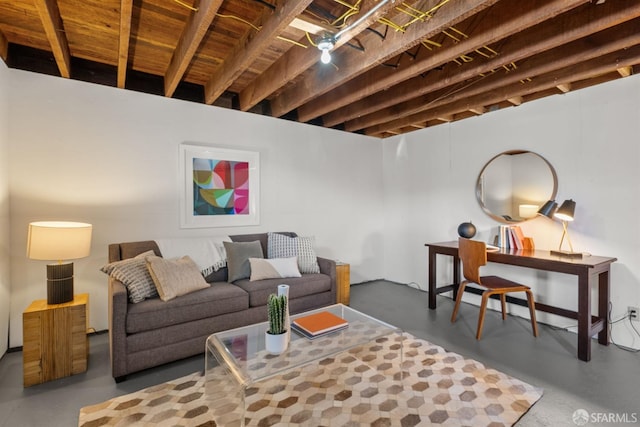 living area featuring finished concrete flooring
