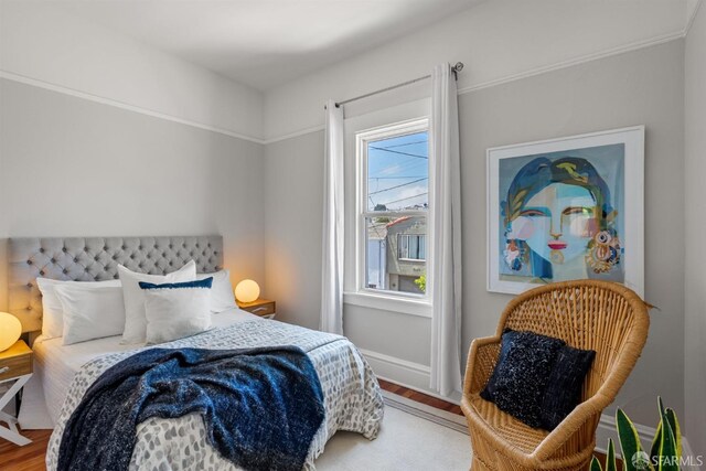 bedroom featuring wood finished floors