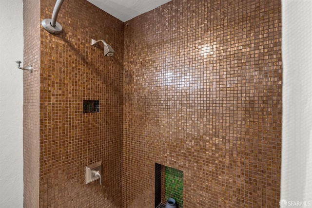 bathroom with tiled shower