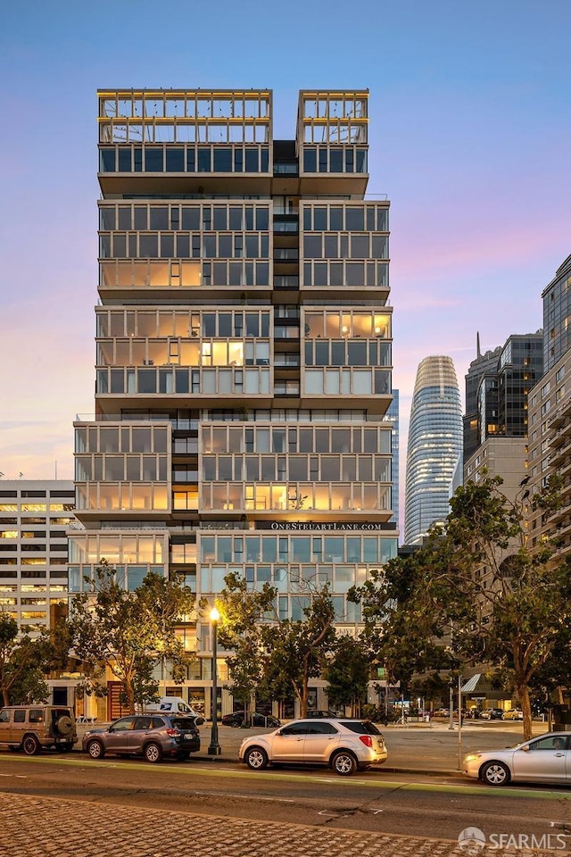 view of outdoor building at dusk