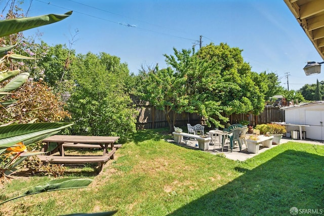 1146 Carlton Ave, Menlo Park, CA 94025 - view of yard featuring a storage unit, an outdoor structure, and a patio