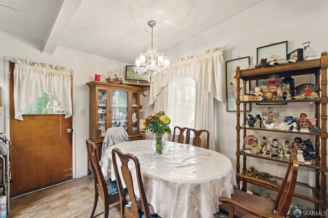 1146 Carlton Ave, Menlo Park, CA 94025 - dining space featuring a chandelier, wood finished floors, beam ceiling, and healthy amount of natural light
