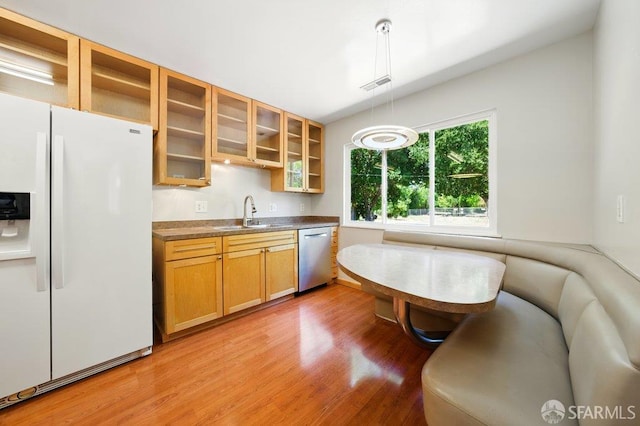 1835 Clayton Way, Concord, CA 94519 - kitchen with white fridge with ice dispenser, stainless steel dishwasher, a sink, and light wood finished floors