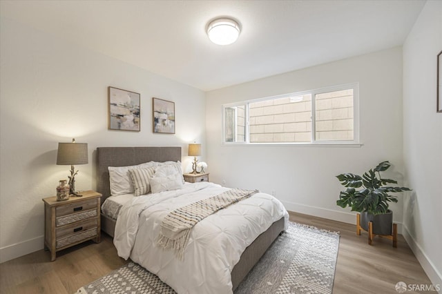 bedroom featuring hardwood / wood-style flooring