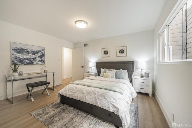 bedroom featuring wood-type flooring