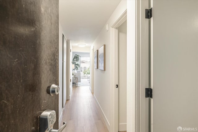 corridor featuring light hardwood / wood-style floors