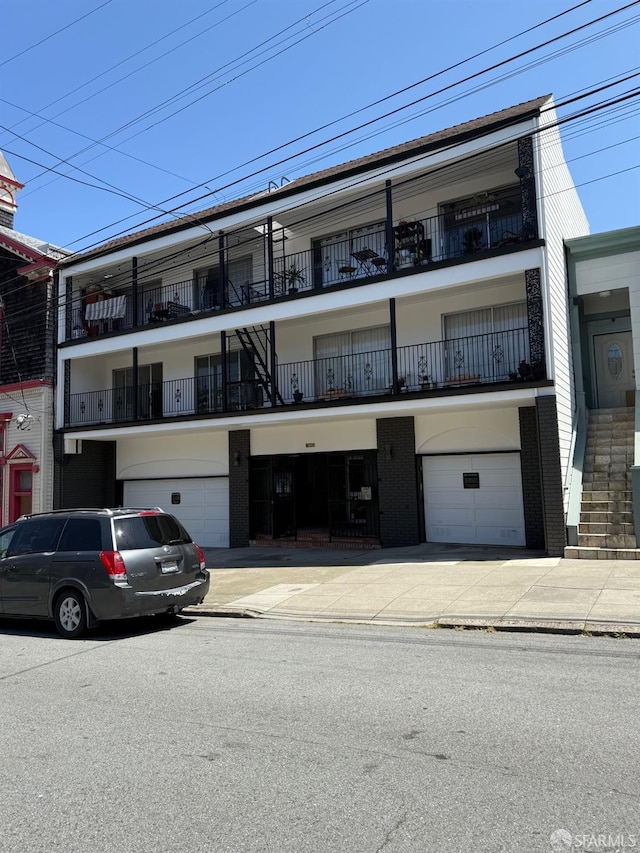 1352 10th Ave Unit 102, San Francisco, CA 94122 - view of building exterior with an attached garage