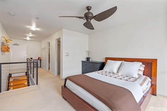 bedroom with carpet flooring, baseboards, and ceiling fan