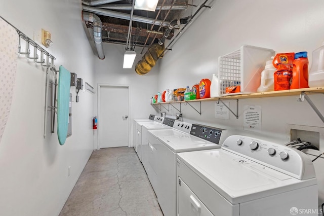 laundry area with washing machine and dryer
