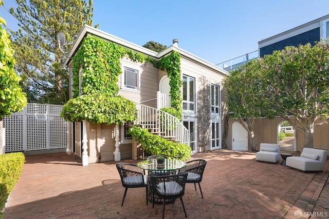 view of patio / terrace with stairs and outdoor dining space