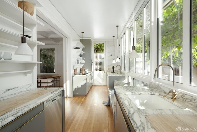 unfurnished sunroom with a sink