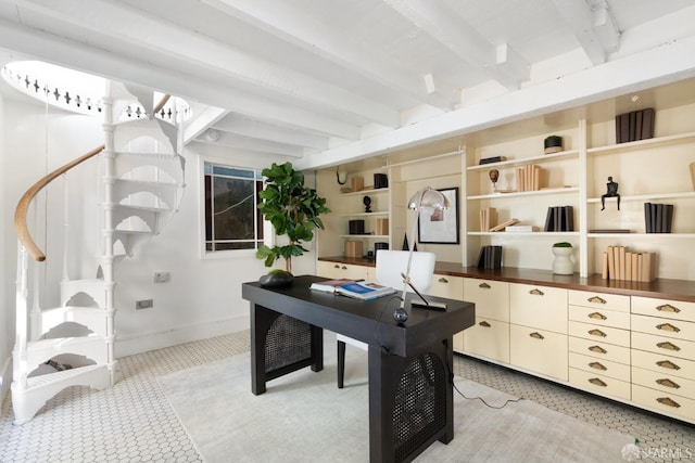 office space featuring beam ceiling and baseboards