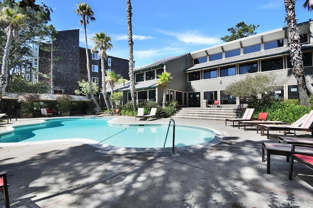 pool with a patio area