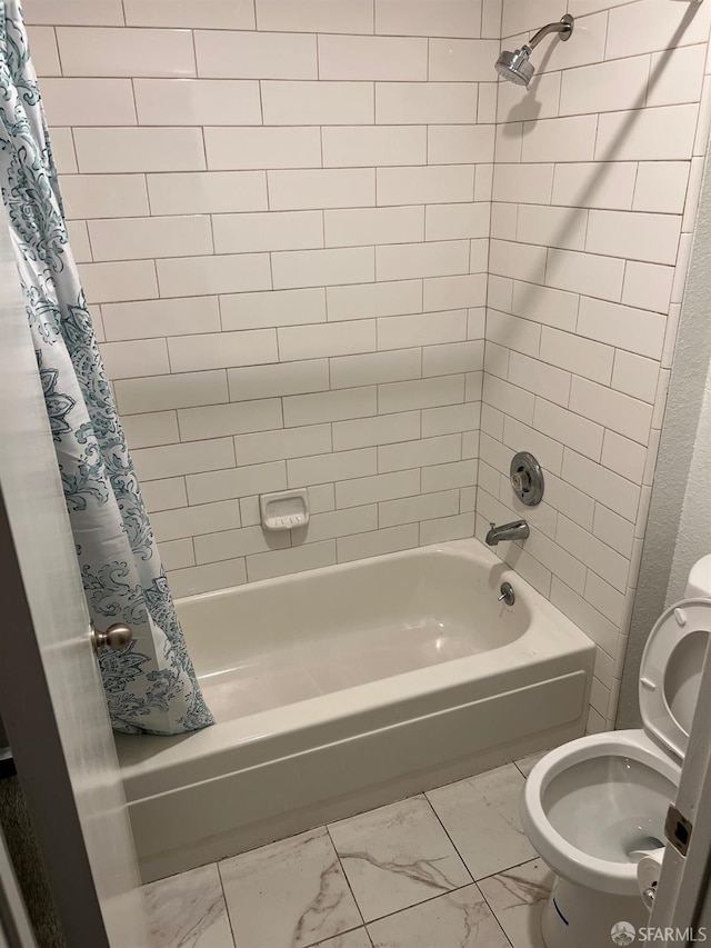 bathroom with shower / bath combination with curtain and toilet