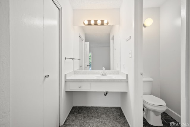 1919 Ygnacio Valley Rd Unit 33, Walnut Creek, CA 94598 - bathroom with toilet, a sink, and baseboards
