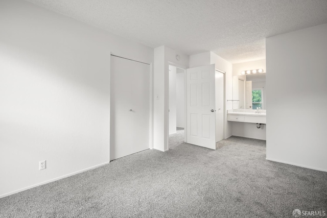 1919 Ygnacio Valley Rd Unit 33, Walnut Creek, CA 94598 - unfurnished bedroom featuring carpet flooring, a textured ceiling, ensuite bathroom, and a closet