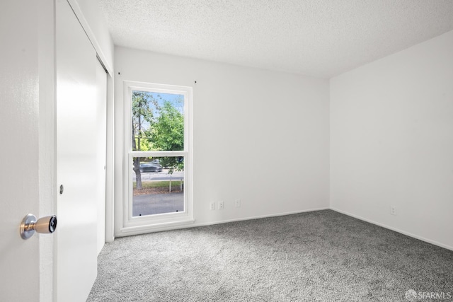 1919 Ygnacio Valley Rd Unit 33, Walnut Creek, CA 94598 - carpeted spare room featuring a textured ceiling and baseboards