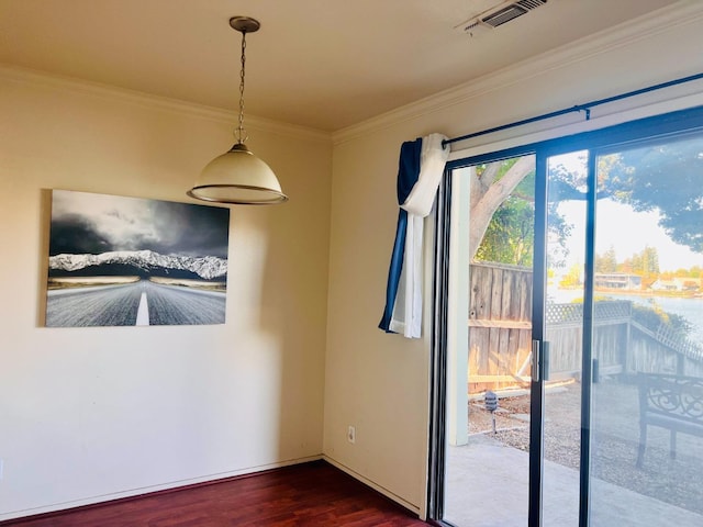 unfurnished dining area featuring crown molding and dark hardwood / wood-style flooring