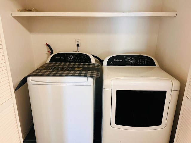 laundry area with separate washer and dryer