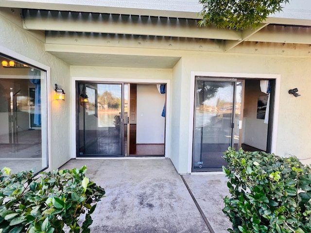 doorway to property featuring a patio area