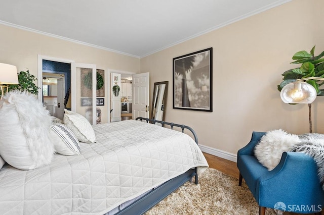 bedroom with ornamental molding and hardwood / wood-style flooring