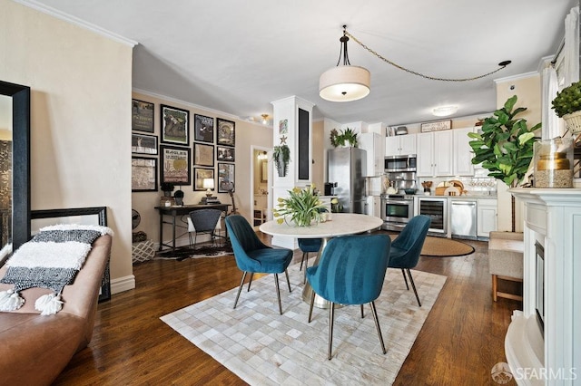 dining space featuring crown molding, wine cooler, and dark hardwood / wood-style floors