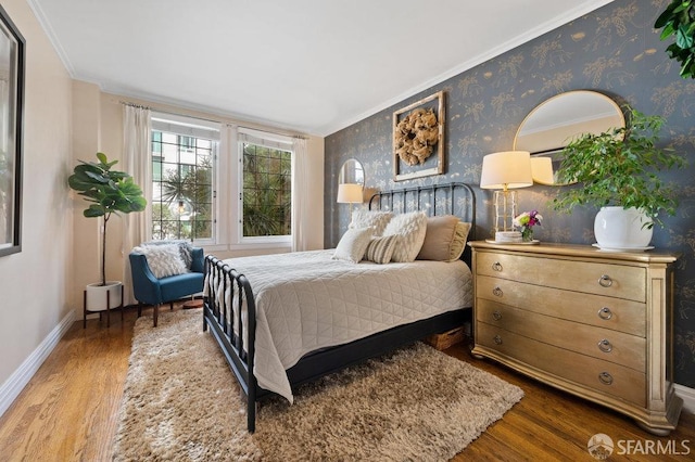 bedroom with crown molding and hardwood / wood-style floors