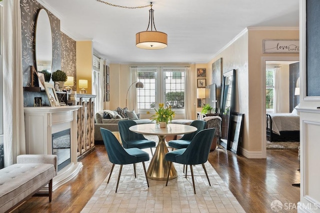 dining room featuring ornamental molding and hardwood / wood-style flooring