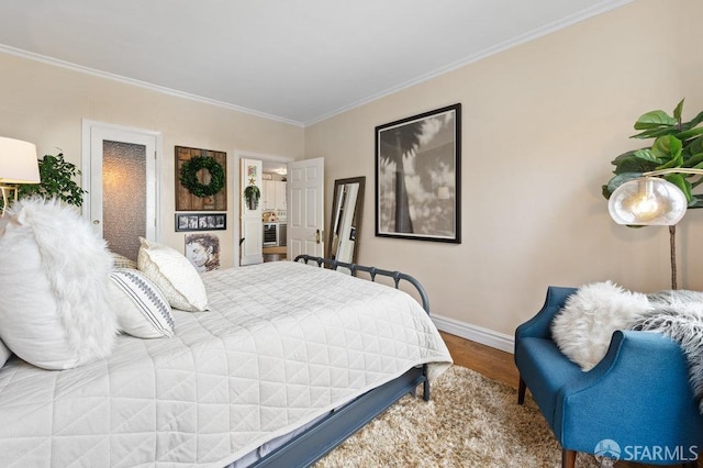 bedroom featuring hardwood / wood-style floors and ornamental molding