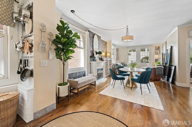 dining area featuring crown molding and hardwood / wood-style floors