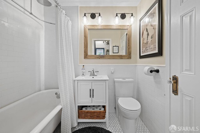 full bathroom with toilet, vanity, tile walls, tile patterned floors, and shower / bath combination with curtain