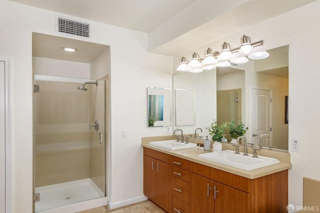 full bathroom with a sink, visible vents, and a shower stall