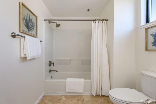 bathroom featuring tile patterned floors, baseboards, toilet, and shower / bath combination with curtain