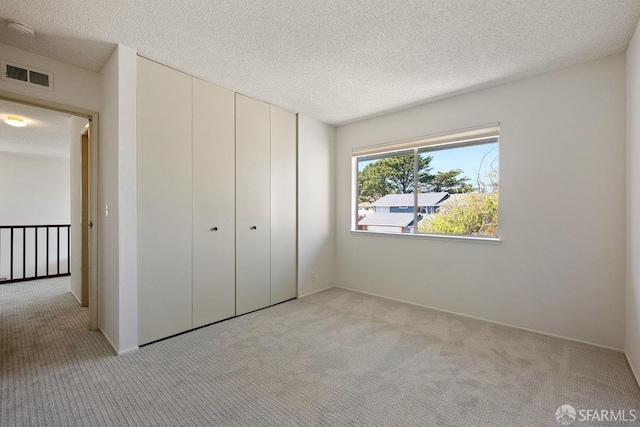 2691 Sean Ct, South San Francisco, CA 94080 - unfurnished bedroom with light carpet, a closet, and a textured ceiling