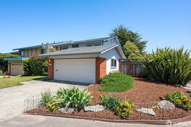 2691 Sean Ct, South San Francisco, CA 94080 - traditional-style home featuring concrete driveway, brick siding, a shingled roof, and a garage