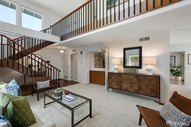 2691 Sean Ct, South San Francisco, CA 94080 - living room featuring carpet flooring, plenty of natural light, stairway, and a towering ceiling