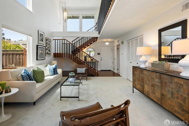 2691 Sean Ct, South San Francisco, CA 94080 - living area with carpet floors, stairs, and a high ceiling