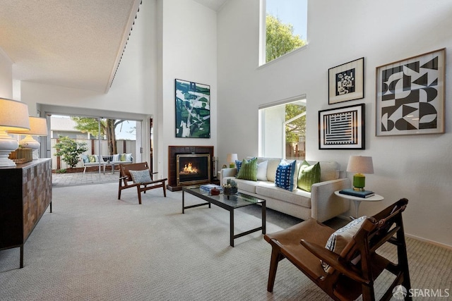 2691 Sean Ct, South San Francisco, CA 94080 - living area featuring carpet floors, a lit fireplace, a high ceiling, and baseboards