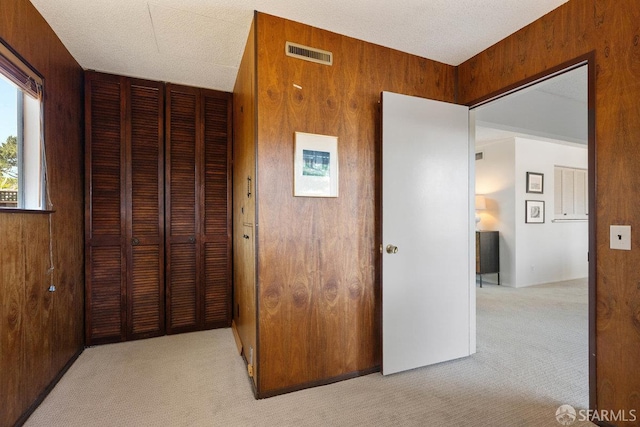 2691 Sean Ct, South San Francisco, CA 94080 - unfurnished bedroom featuring carpet, a closet, and wood walls