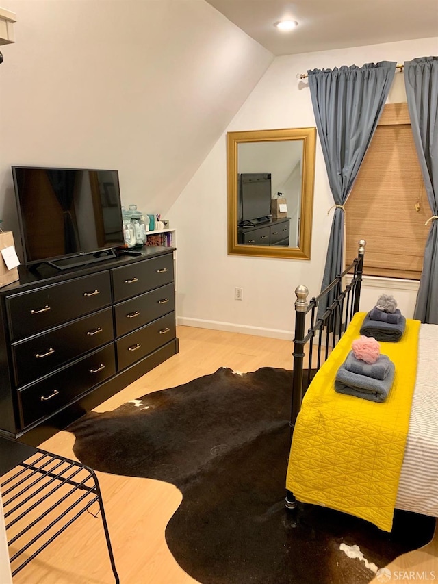 bedroom with vaulted ceiling